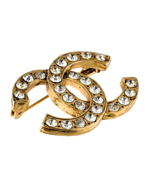 chanel broche suit|Chanel crystal brooches.